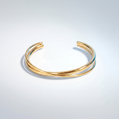 Bangle Rigido Crossover Oro 18K - flat lay con pezzi coordinati - UpperEast Jewels