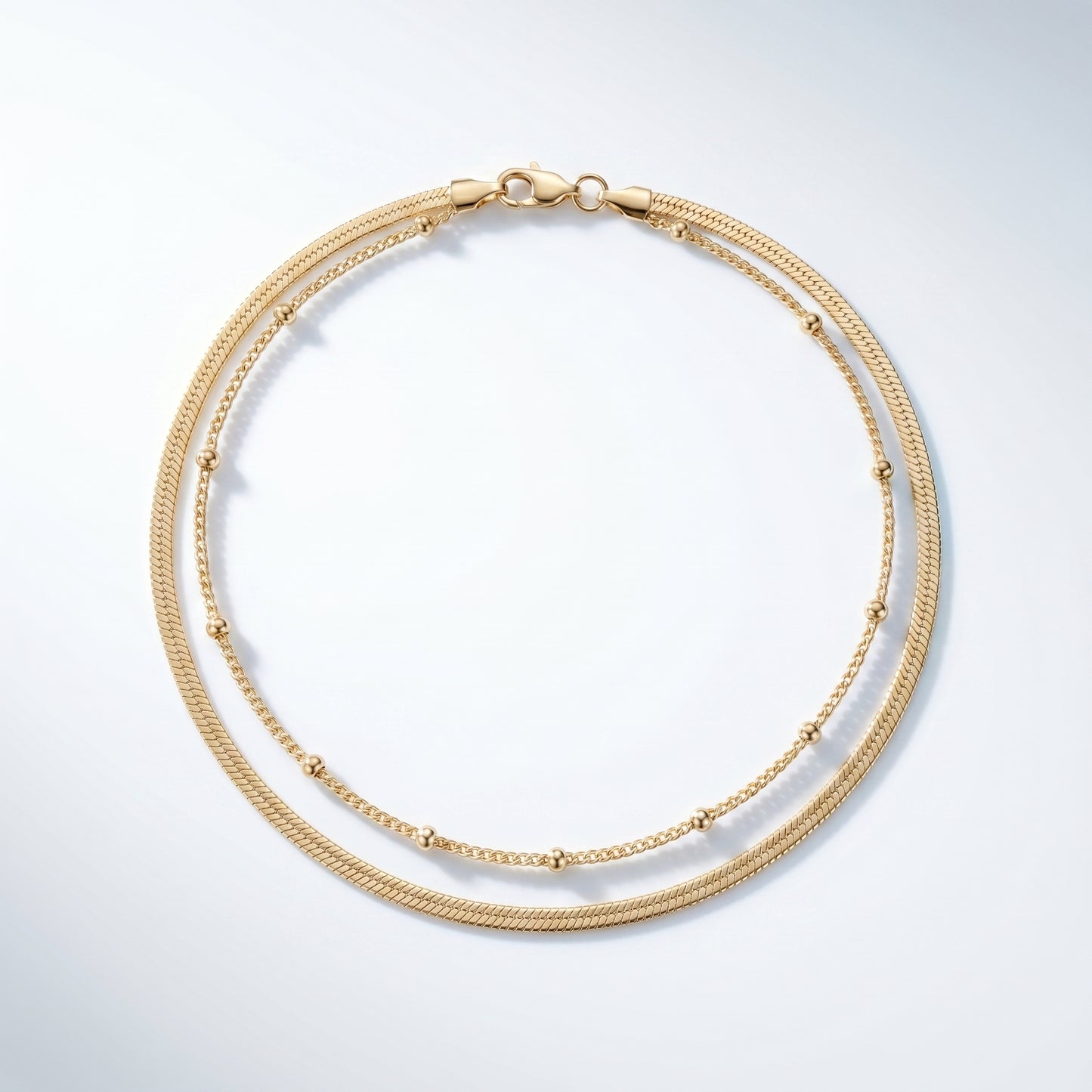 Cavigliera Layered Doppia Oro 18K - vista dall'alto top-down - UpperEast Jewels