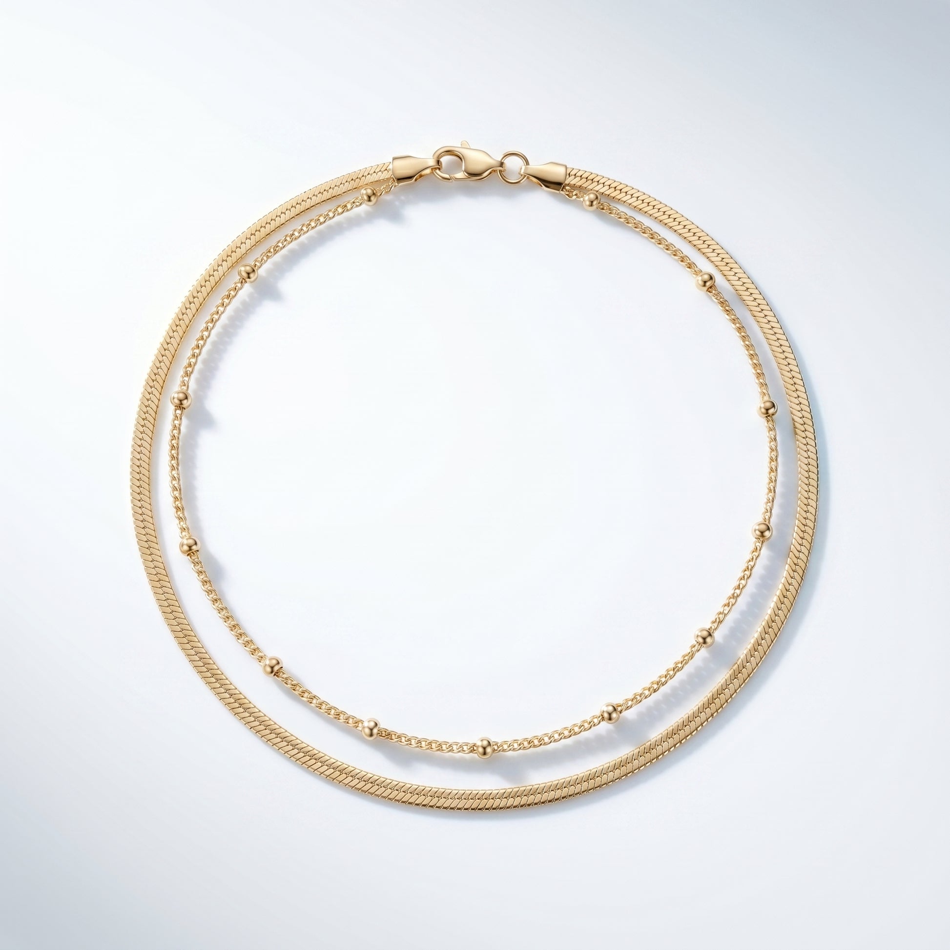 Cavigliera Layered Doppia Oro 18K - vista dall'alto top-down - UpperEast Jewels