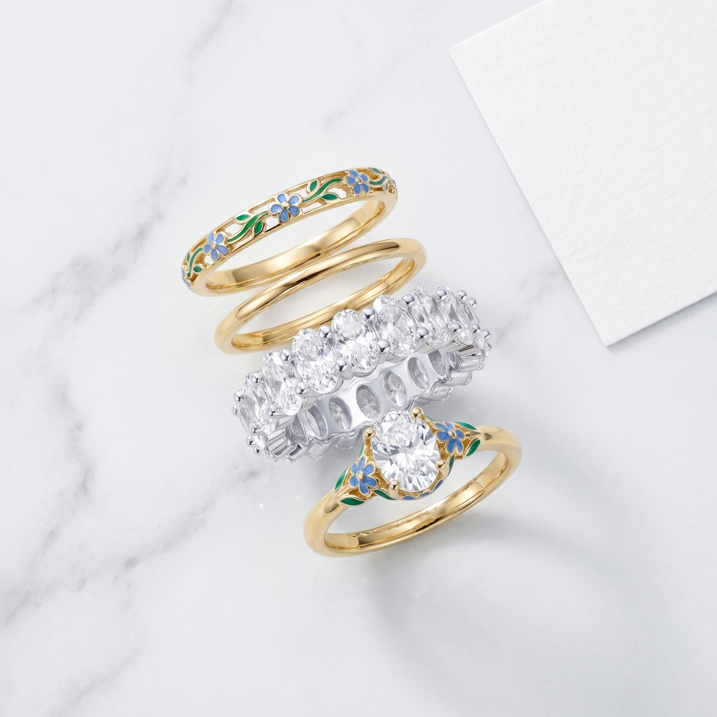 Anello Eternity Ovale CZ Oro 18K - flat lay con pezzi coordinati - UpperEast Jewels