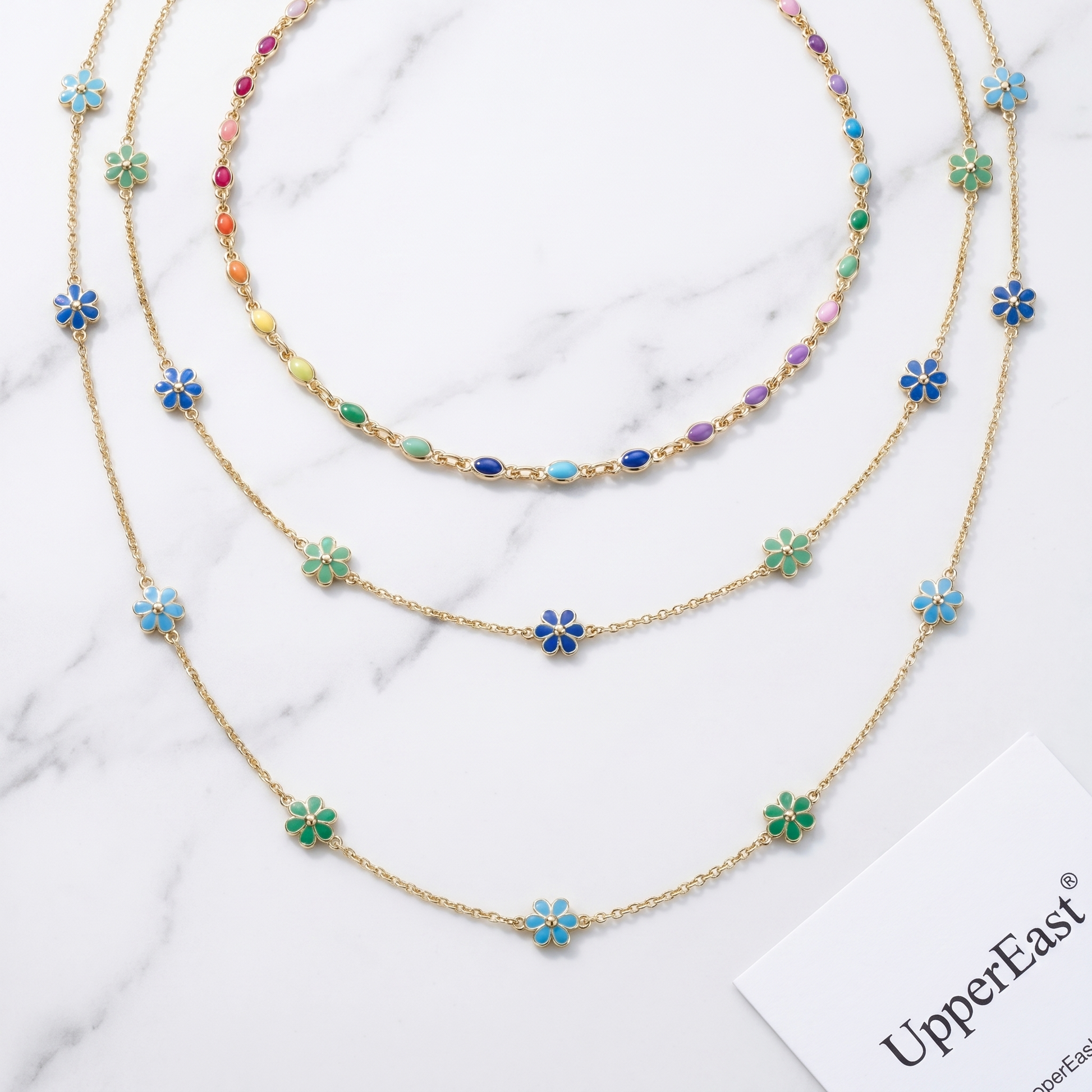 Choker Arcobaleno Multi-Stone Oro 18K - flat lay con pezzi coordinati - UpperEast Jewels