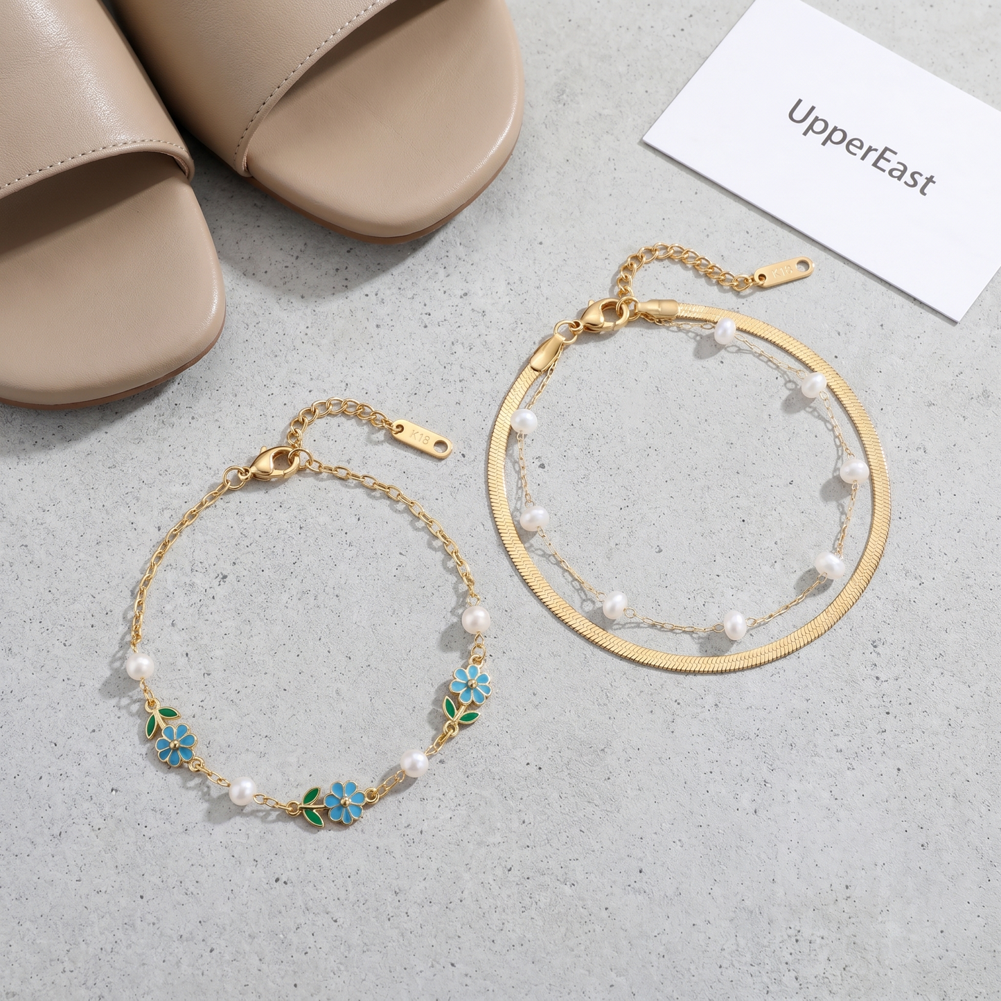 Cavigliera Snake Chain Oro 18K - flat lay con pezzi coordinati - UpperEast Jewels