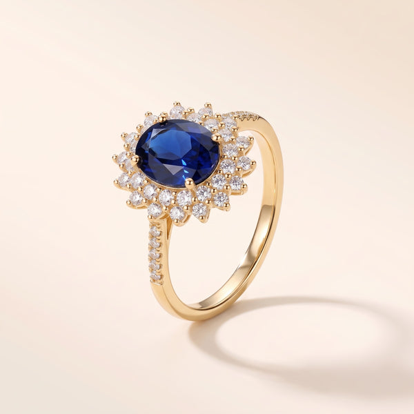 Anillo con piedra azul y circonitas bañado en oro de 18K