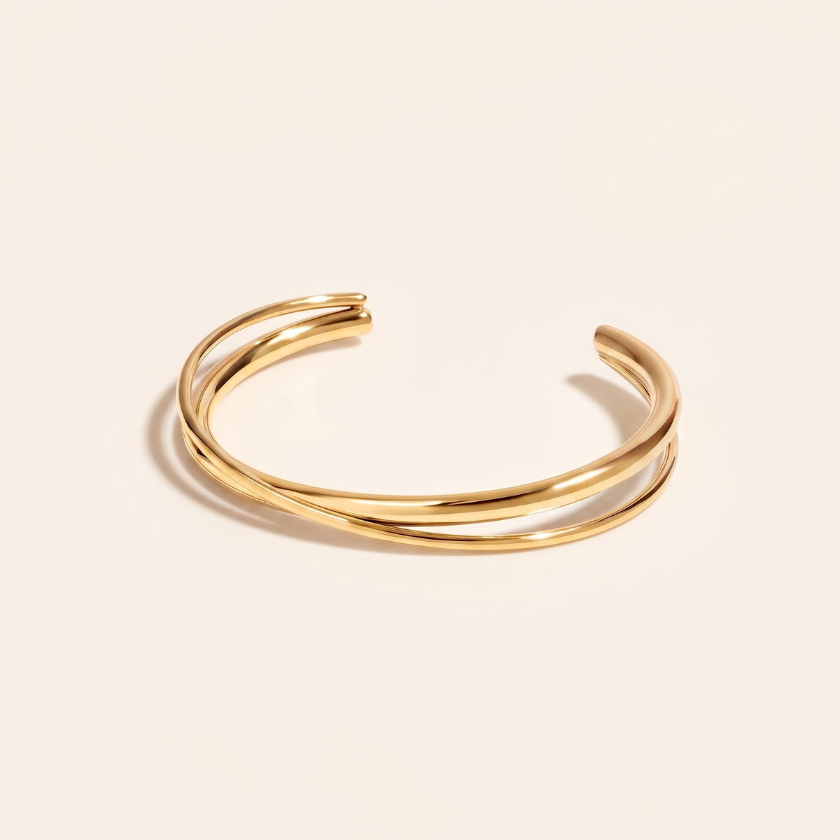 Bracciale rigido incrociato placcato oro 18K