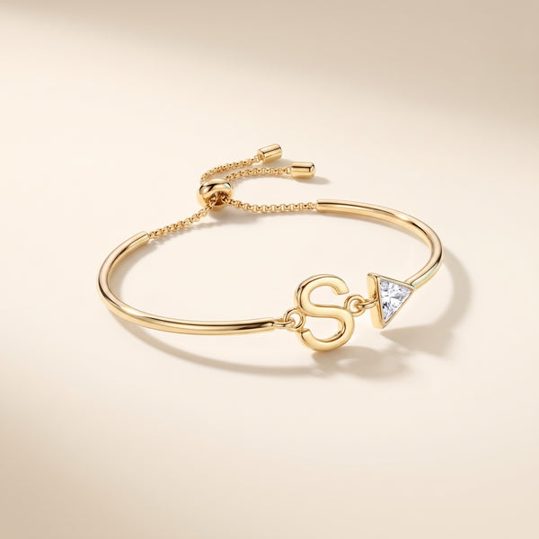 Pulsera con inicial y cristal bañada en oro de 18K