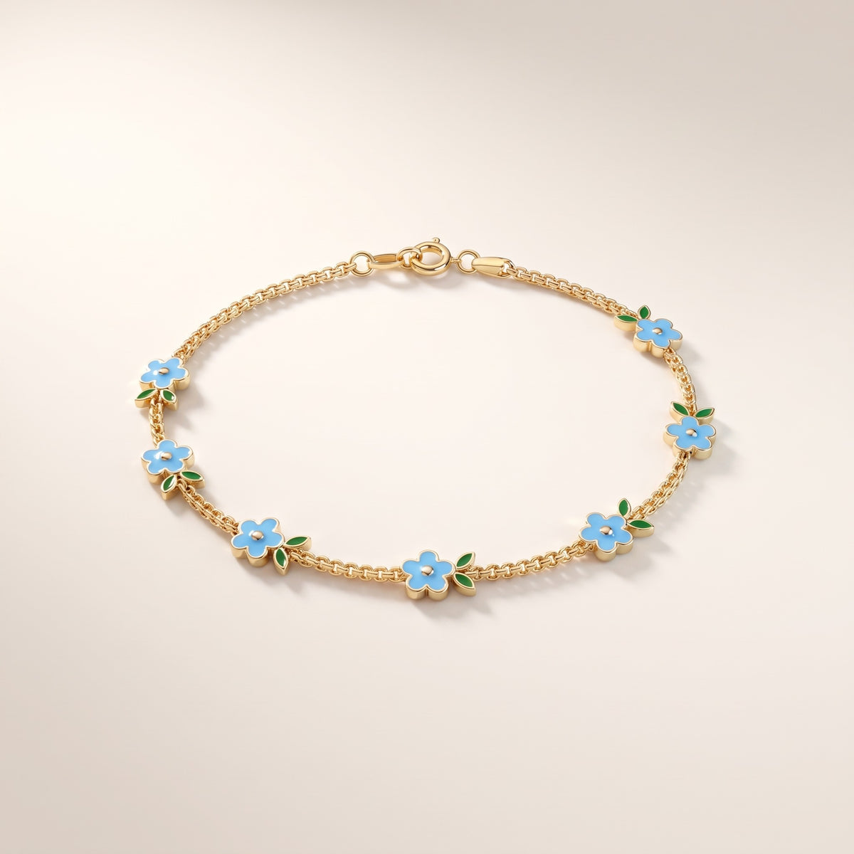 Pulsera con flores esmaltadas bañada en oro de 18K