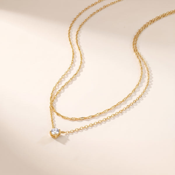 Collar en capas con punto de luz bañado en oro de 18K