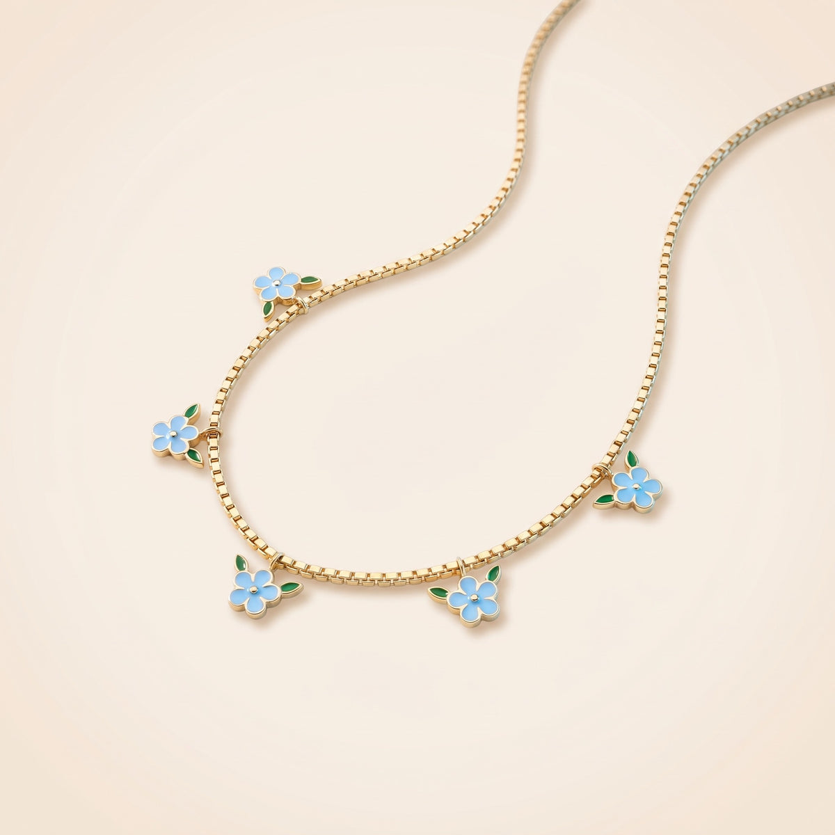 Collana con fiori smaltati azzurri placcata oro 18K