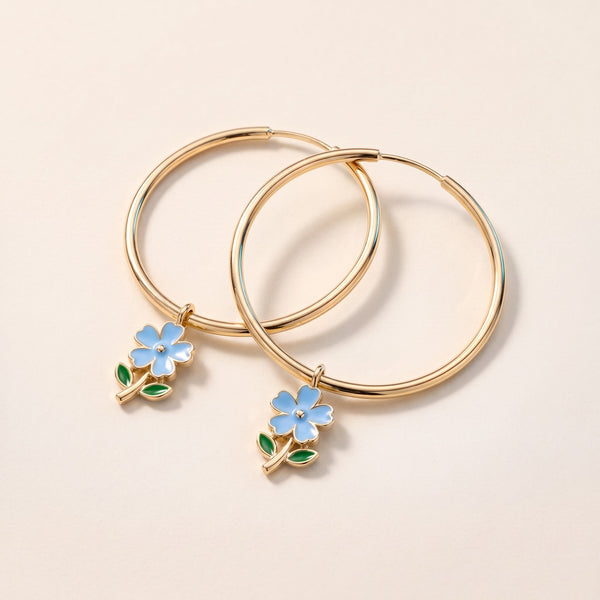 Pendientes de aro maxi con flores bañados en oro de 18K