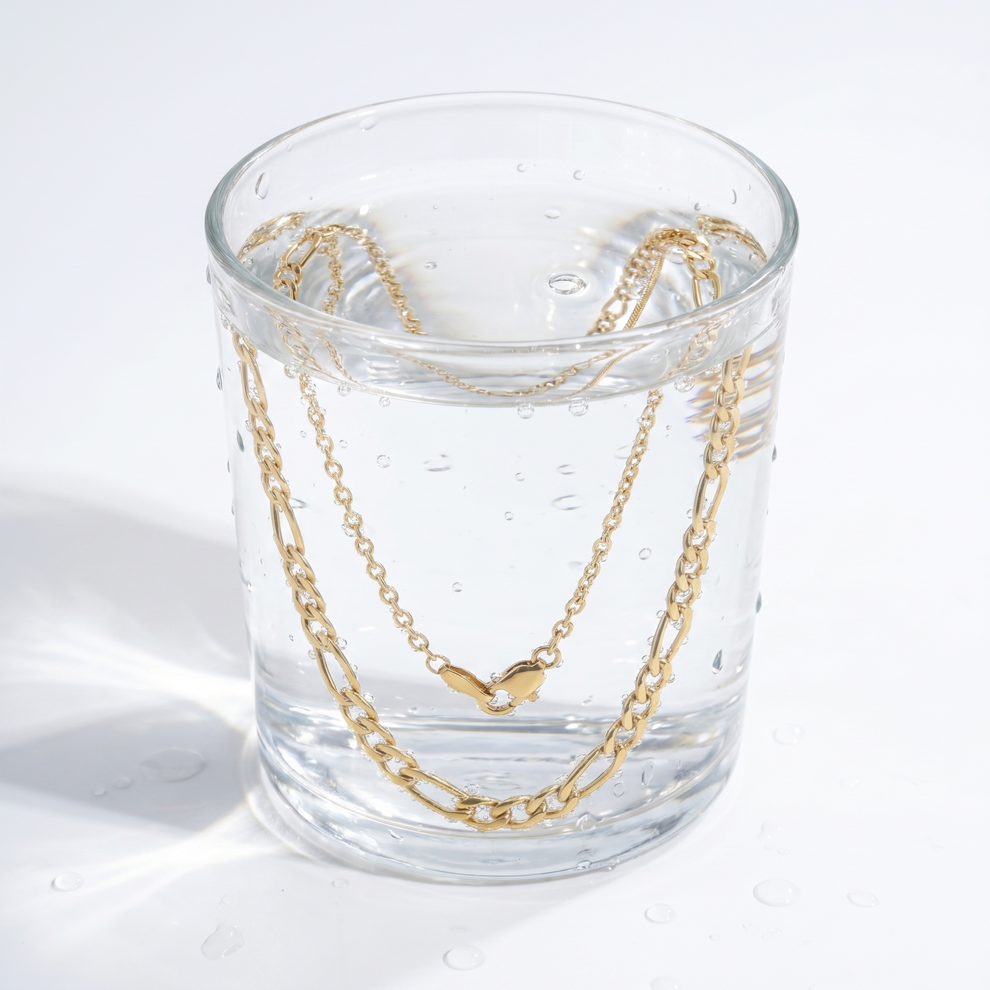 Collana Figaro Layered Oro 18K — 09-stress-proof