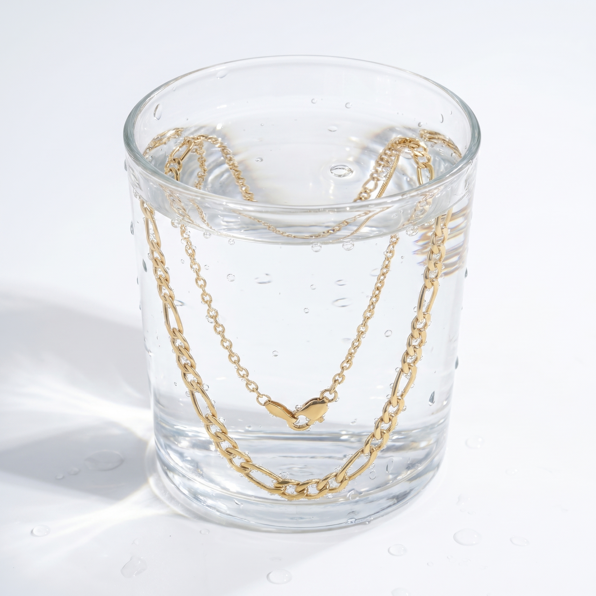 Collana Figaro Layered Oro 18K — 09-stress-proof